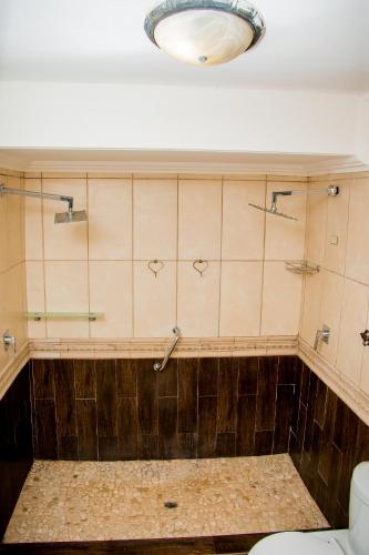 a bathroom with a toilet and a light at Noah Garden in Johannesburg