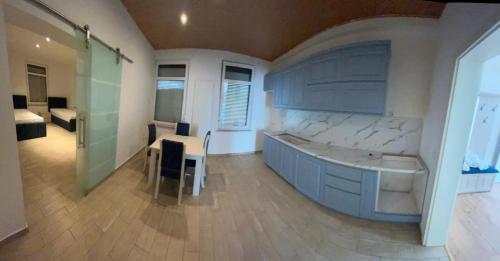 a large bathroom with a tub and a bedroom at Ferienwohnung in Glauchau