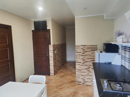 a kitchen with a counter top and a refrigerator at Comfort Akacija Apartments in Vilnius