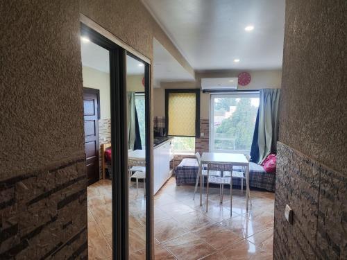 a living room with a table and a couch at Comfort Akacija Apartments in Vilnius