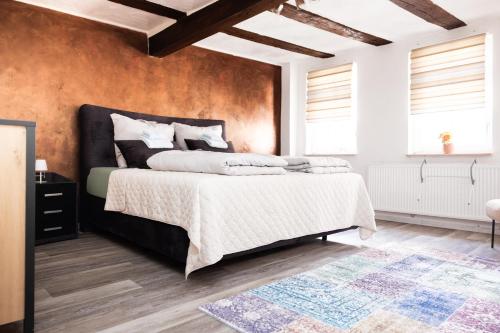 a bedroom with a large bed in a room at Mediterran Apartments-Cabernet Sauvignon in Fulda