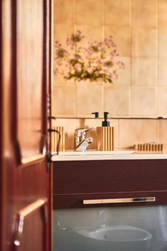 a bathroom with a sink and a mirror at Douro Panorama Valley in Pinhão