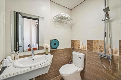 a bathroom with a toilet and a sink at Miah Ha Noi Hotel - the best choice in Hà Nội Old Quarter in Hanoi