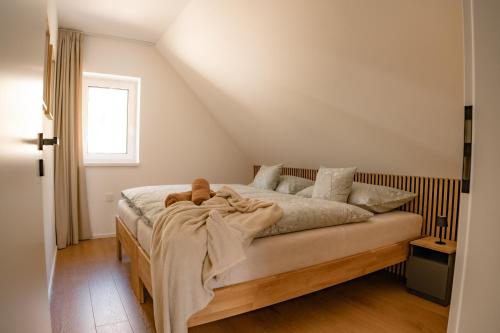 a bedroom with a bed with a blanket on it at Chata Špička in Smržovka