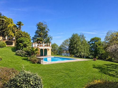 an estate with a swimming pool and a house at Villa Romilda in Arona