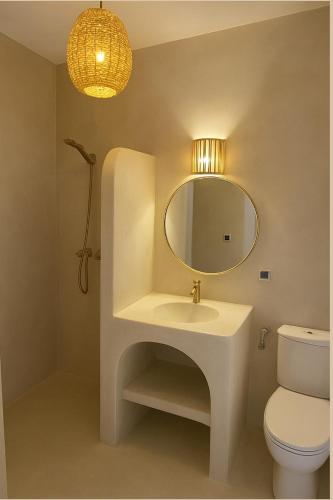 a bathroom with a sink and a mirror at Sines Surfmaroc in Tamraght Ouzdar
