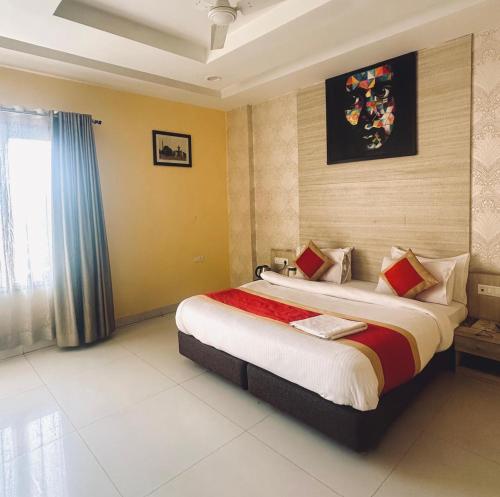 a bedroom with a large bed in a room at Hotel Asha in Kannauj