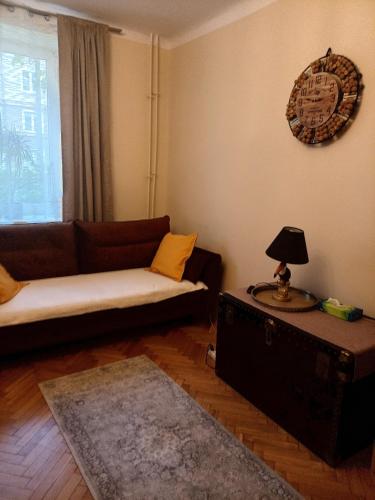 a living room with a couch and a table at E-Brechta in Warsaw