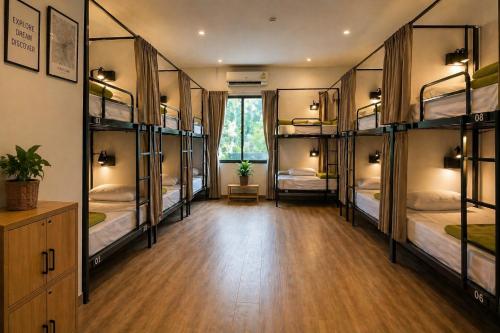 a room with a bunch of bunk beds at HideSeek Hostel Vientiane Thai embassy in Vientiane