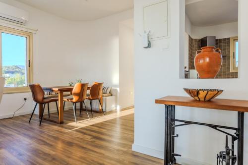 a dining room with a table and chairs at Villa Enalia Paphos in Paphos
