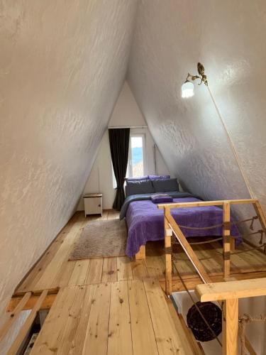 a bedroom with a bed in a attic at Metsadzor Resort, Areni in Areni