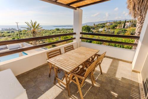 a table and chairs on the balcony of a villa at Nireas Villa in Paphos