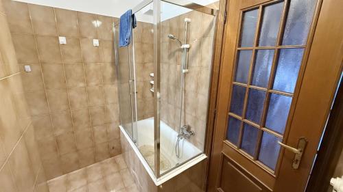 a shower with a glass door in a bathroom at Casa Cretier in Aosta