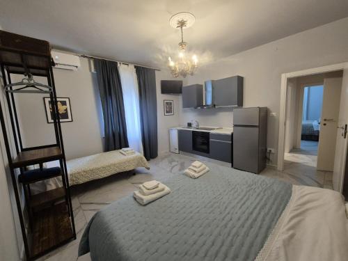 a bedroom with a bed with two towels on it at Cascina Antiche Terre in Campegine