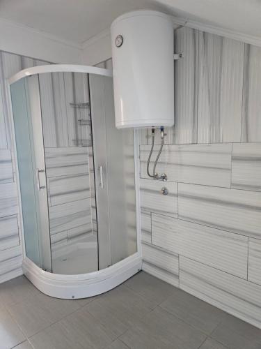 a bathroom with a shower and a white at Rooms & Apartment Jozić in Prozor