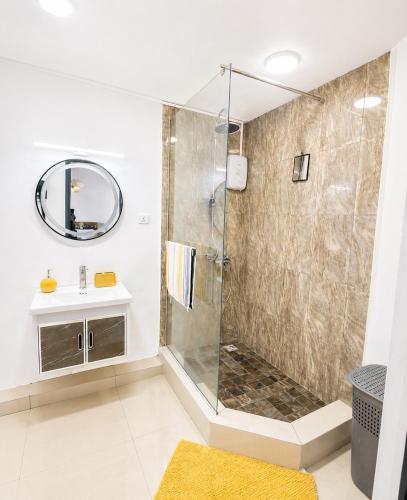 a bathroom with a shower and a sink at Sea La Vie Villa in Grande Gaube