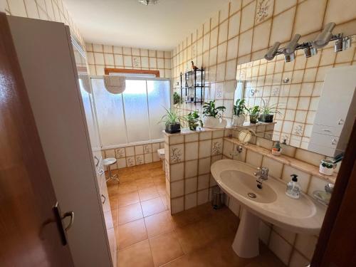 a bathroom with a sink and a mirror at Chalet Can Bola in Arbeca
