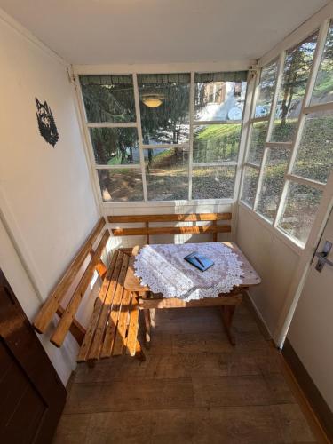 a small room with a table in front of a window at Chaty Kašperské Hory in Kašperské Hory