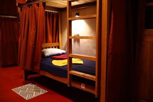 a bunk bed room with two bunk beds in it at Sigiri Serenity Hostel in Sigiriya
