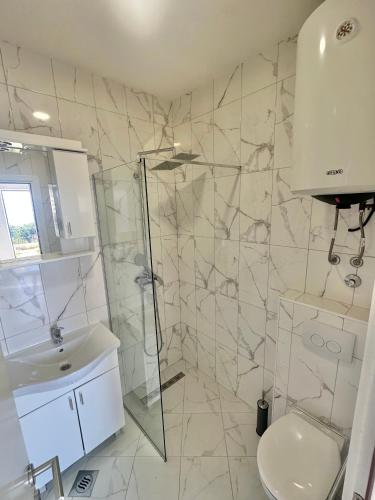 a bathroom with a shower and a toilet and a sink at Smolović Luxury Apartments Herceg Novi-Sea View,Free Parking in Zelenika
