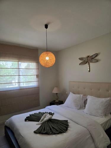 a bedroom with two beds and a ceiling fan at Casa Ghjuvanna in Propriano