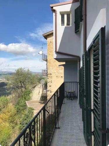 a balcony of a building with a table on it at Casa Sirolli in Archi