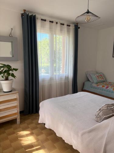Postelja oz. postelje v sobi nastanitve Le petit gîte
