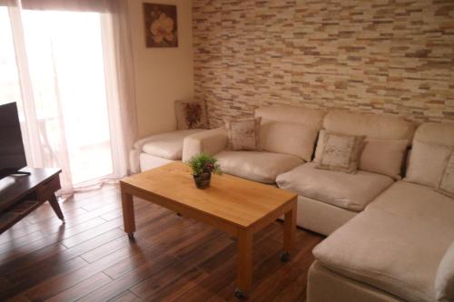 a living room with a couch and a coffee table at SUNSHINE APTS, TWO BEDROOM , FREE INTERNET, No 3 in Ayia Napa