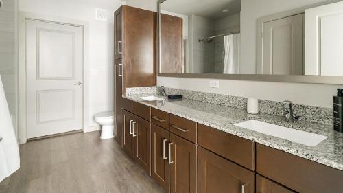 a bathroom with a sink and a toilet at Landing Incredible 2BD Gym in New Caney