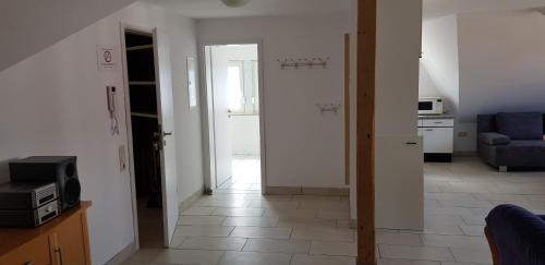 a living room with a couch and a tv at Griesenstraße in Warendorf