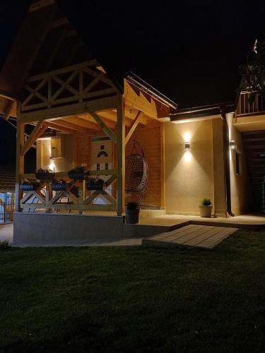 a house with a patio at night at Kuća za odmor "Moja idila" in Vrnjačka Banja
