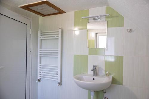 a bathroom with a sink and a mirror at Вила Карапча in Stoyan Zaimovo