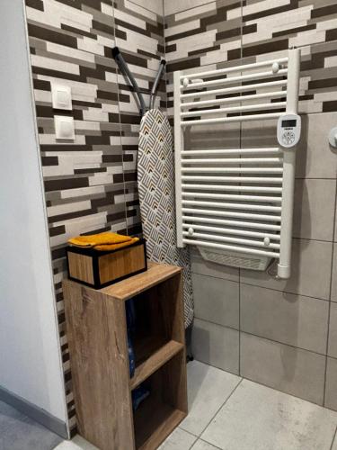 a bathroom with a sink and a toilet in a room at Gîte au Petit Café in Châteauvillain
