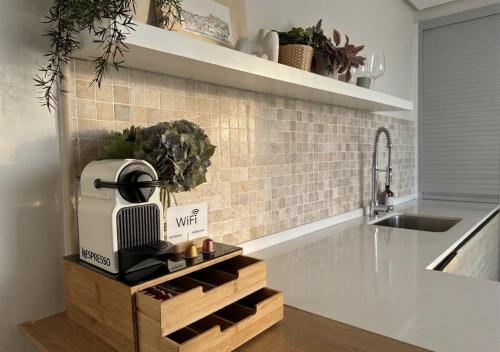 a kitchen with a sink and a appliance on a counter at BILBAO ENEA - Apartamento 2 habitaciones cerca de San Mamés in Bilbao