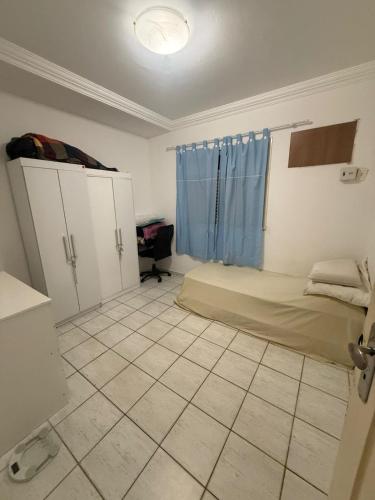 a room with a bed and a window in it at Natal Exclusive Pool Villa Private Community in Natal