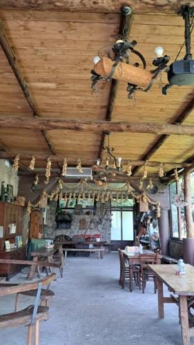 a large room with wooden ceilings and wooden tables at Rifugio Capo D,acqua in Positano