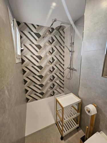 a bathroom with a shower and a walk in shower at Hawaii Beach Can Picafort in Can Picafort