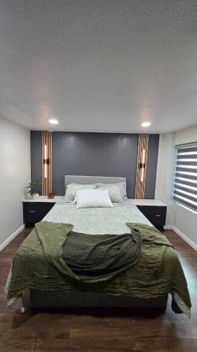 a bedroom with a large bed in a room at Cozy Private Retreat in Phoenix