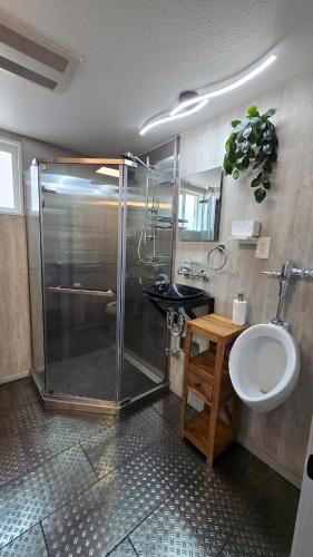 a bathroom with a shower and a sink at Cozy Private Retreat in Phoenix