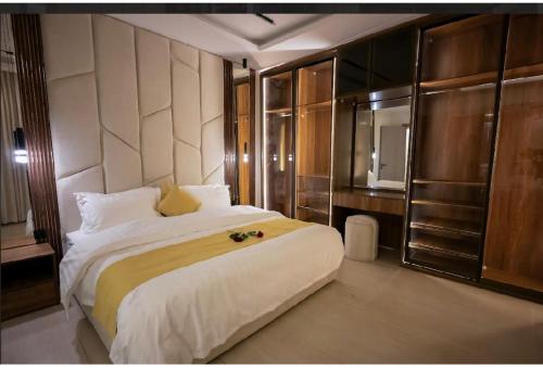 a bedroom with a large bed and a television at شقة مودرن مع جاكوزي خاص دخول ذاتي in Riyadh