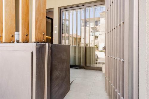 a hallway with a metal partition in a building at Yamas Urban Living Olympia Suites Old Town Studio in Limassol