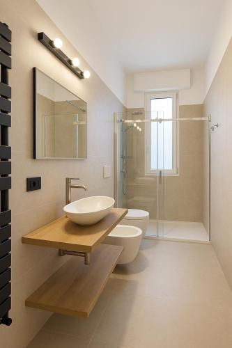 a bathroom with a sink and a toilet and a shower at Affittacamere Villa Soria in Pesaro
