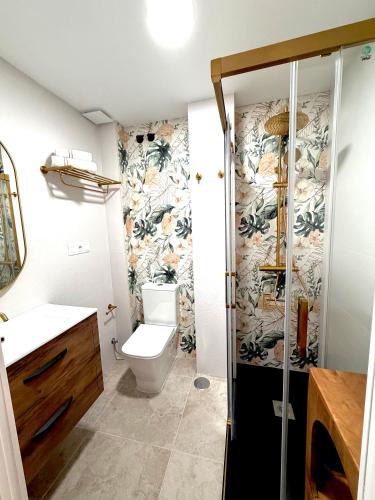 a bathroom with a toilet and a shower at Casa Natali in Fuengirola
