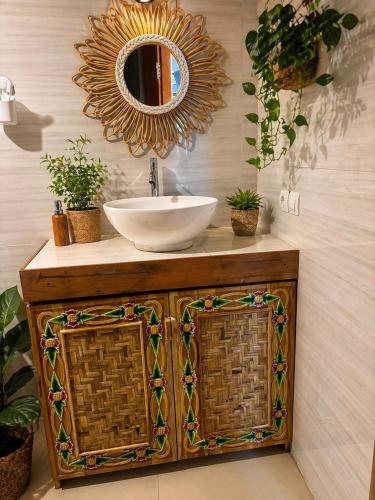 a bathroom with a sink and a mirror at Namali Private Villa in Gili Trawangan