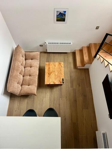 a living room with a couch and a table at Palguin pad loft # 1 in Pucón