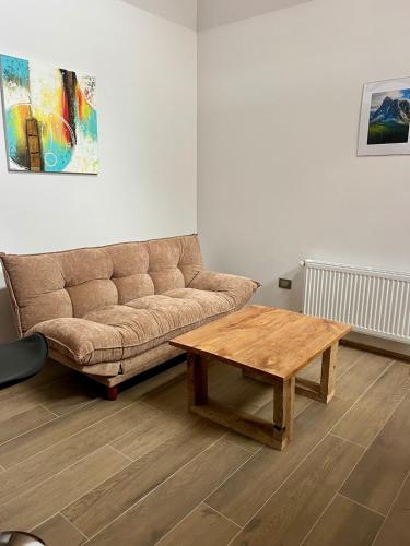 a living room with a couch and a coffee table at Palguin pad loft # 1 in Pucón