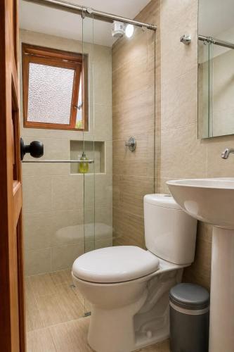 a bathroom with a toilet and a sink at Boutique La Gloria in Villa de Leyva