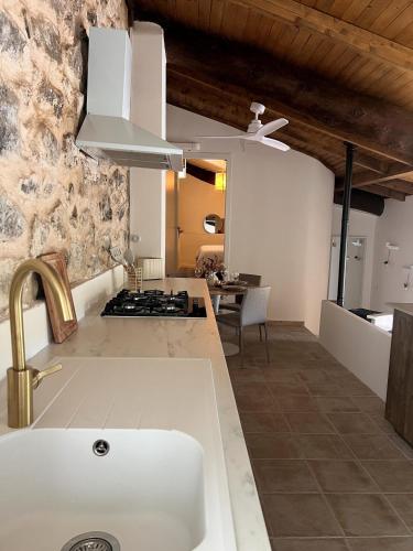 a kitchen with a sink and a stove top oven at Mirramor in Campo de Mirra