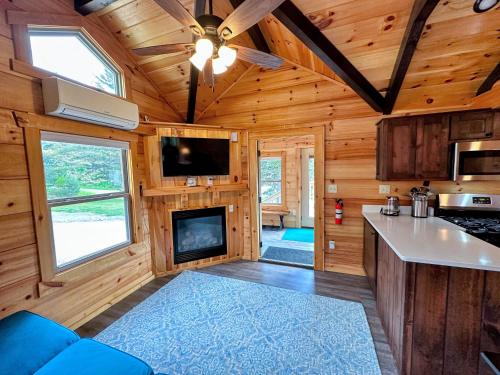 a kitchen and living room of a tiny house at Tiny Home Topline in Carroll