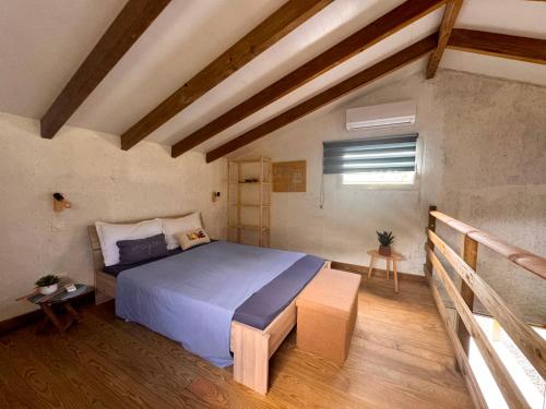 a bedroom with a large bed in a room at Bungalow confortable et calme sud de la Martinique in Rivière-Salée